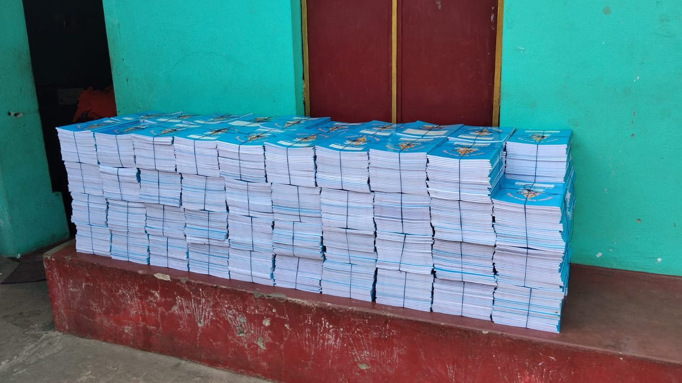 Stacks of Binori notebooks tied in bundles